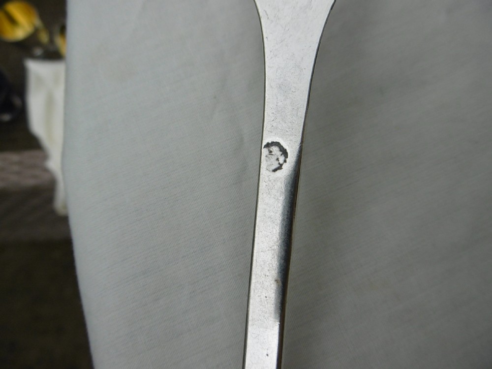 An antique silver dognose tablespoon featuring a rounded oval bowl with a rat-tail stem connection and hallmarks along the narrow handle. View IV