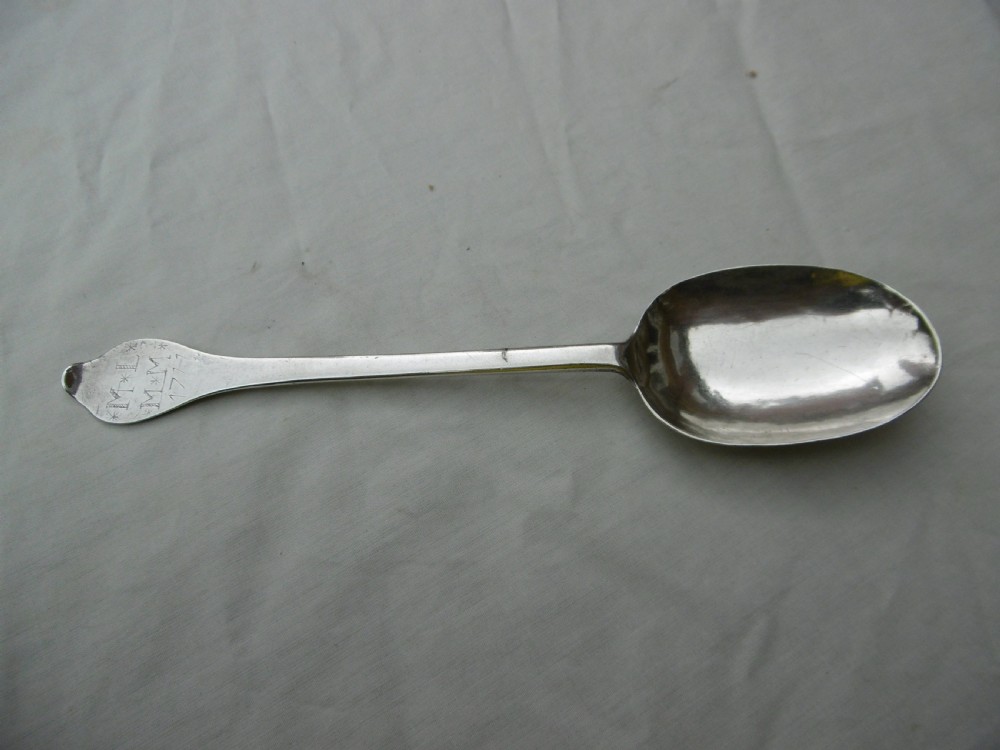 An antique silver dognose tablespoon featuring a rounded oval bowl with a rat-tail stem connection and hallmarks along the narrow handle. View VI