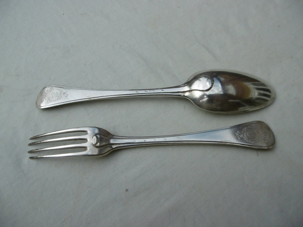 A mid-eighteenth-century sterling silver spoon and four-tined fork crafted in the Hanoverian Thread, Shell and Drop pattern. View II