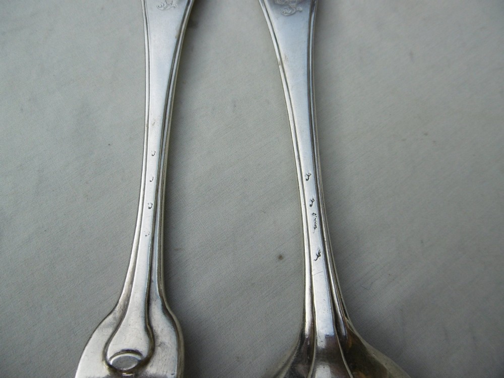A mid-eighteenth-century sterling silver spoon and four-tined fork crafted in the Hanoverian Thread, Shell and Drop pattern. View III