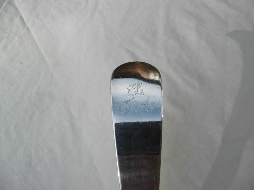 An eighteenth-century Georgian solid silver soup ladle featuring a deep round bowl and a gently curved handle stem. View IV
