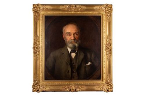 fig 2. An antique oil painting depicting a bearded gentleman wearing a suit coat, set against a dark brown oval spandrel background.