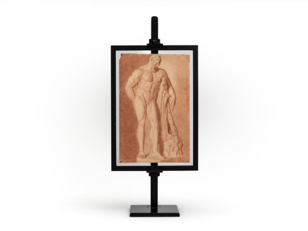 An 18th-century Italian red chalk drawing depicting the classical Farnese Hercules sculpture, mounted in a double-sided black metal display frame.