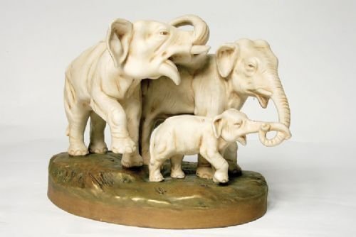 An Antique Royal Dux Group on an Oval Base - Family of Elephants