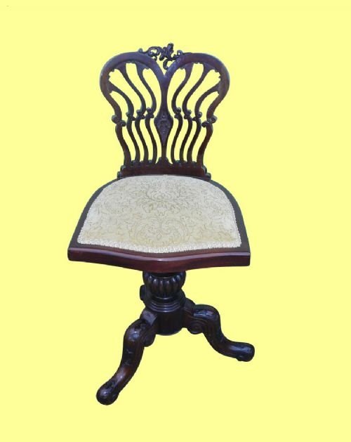 A Victorian Mahogany Antique Music Chair
seat Height  Adjusts by Rotating Seat