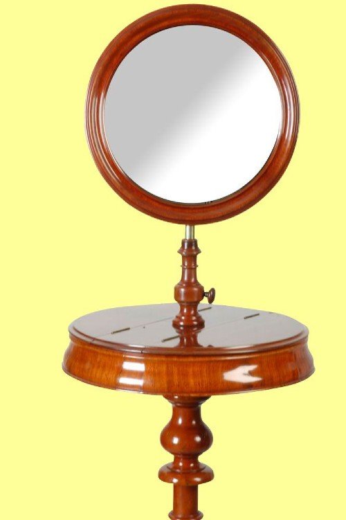 fig 1. A Victorian mahogany antique shaving mirror circa 1880