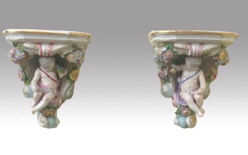Quality Pair of Antique German Porcelain Wall Brackets Finely Adorned with Cupids and Flowers.