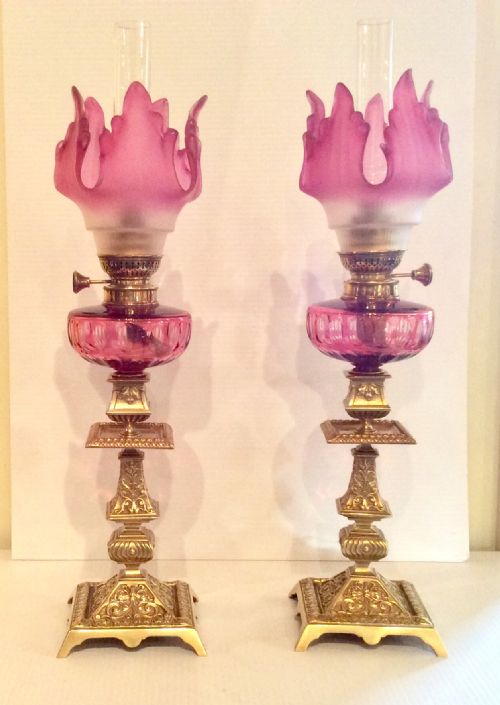 Stunning Matching  Pair of Original Antique Ruby Glass Oil Peg Lamps .