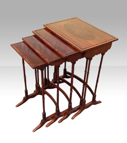 Nest of Four Antique Inlaid Mahogany Tables.