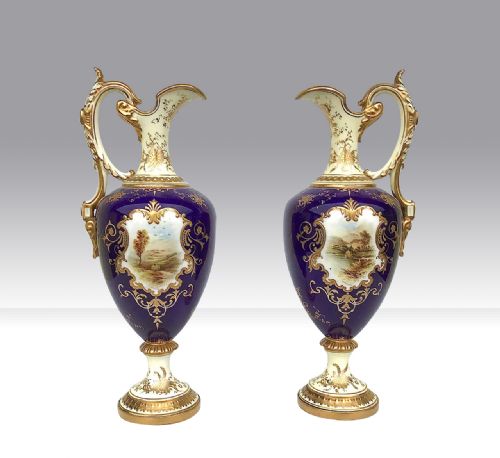 A Pair of Antique Coalport Porcelain Ewers.