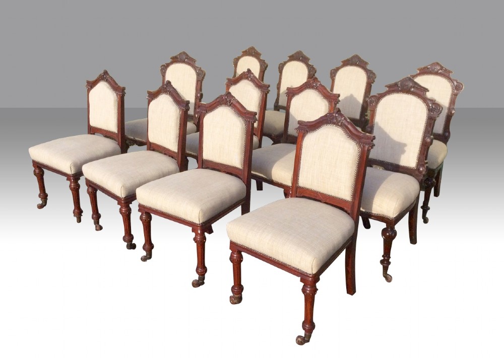 Harlequin set of 12 antique mahogany dining chairs