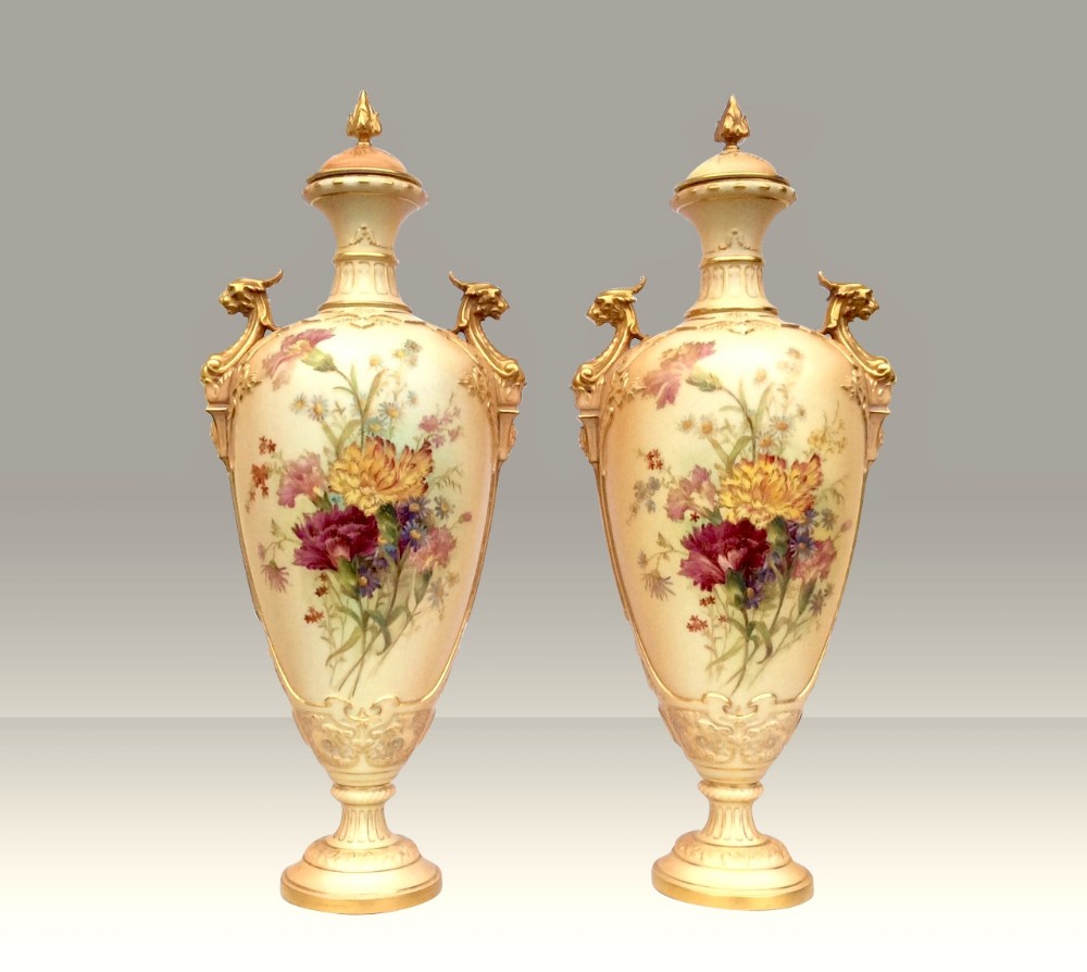 large Pair of Royal Worcester blush ivory floral hand painted urn vases complete with covers.