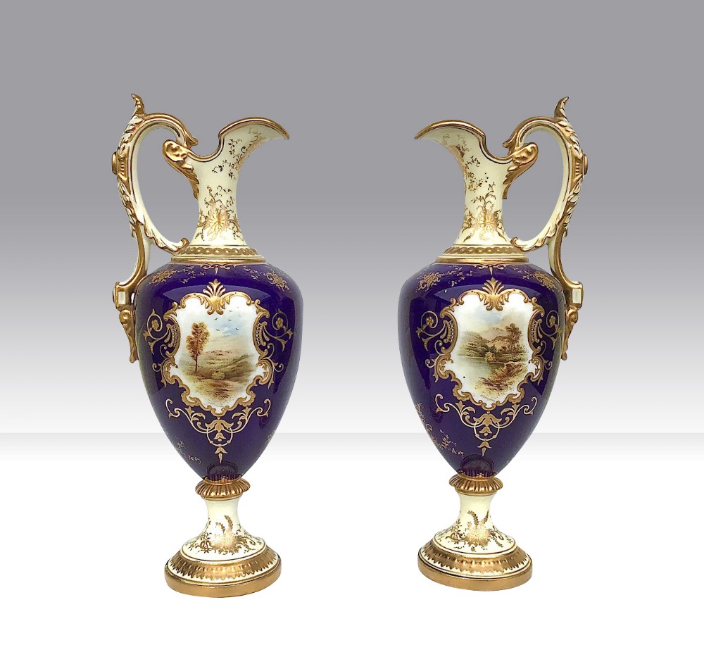 A Pair of Antique Coalport Porcelain Ewers.