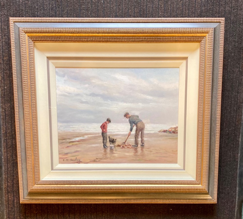 An oil painting on canvas depicting figures and a dog on a sandy shoreline, presented in a stepped gilded and textured wooden frame. View II