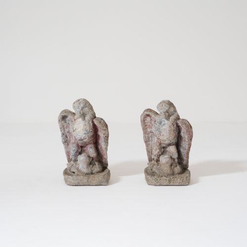 PAIR OF EARLY 20TH CENTURY STONEWARE GARDEN EAGLES