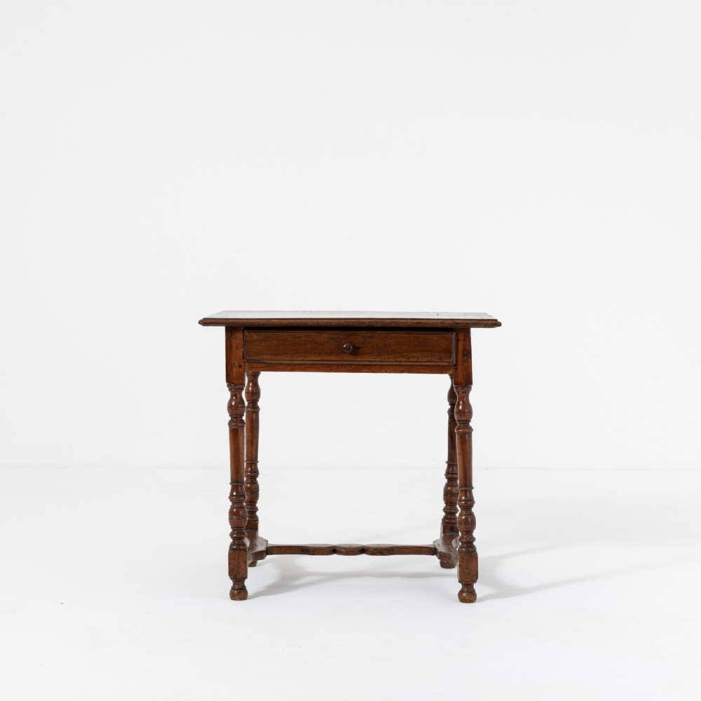 A 17th-century Welsh oak tavern table with turned legs, a single drawer, and an H-stretcher base. View II
