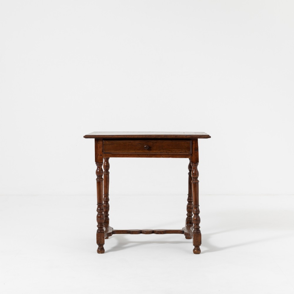 A 17th-century Welsh oak tavern table with turned legs, a single drawer, and an H-stretcher base. View III