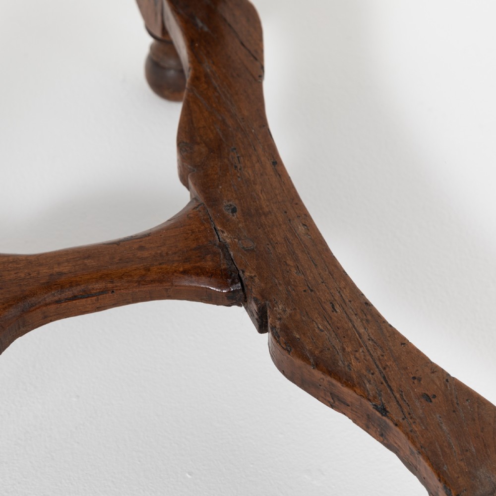 A 17th-century Welsh oak tavern table with turned legs, a single drawer, and an H-stretcher base. View VIII