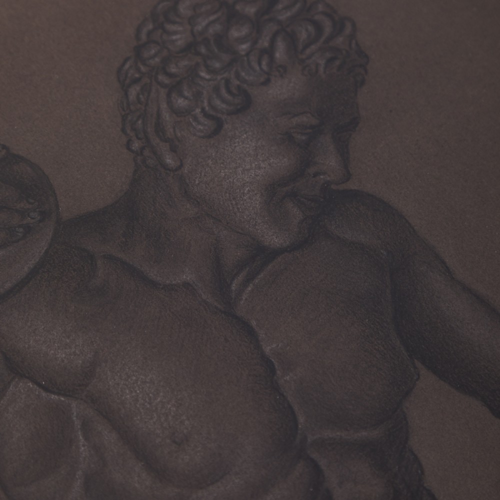 A framed charcoal drawing on dark brown paper depicting a standing classical male faun figure on a pedestal. View II