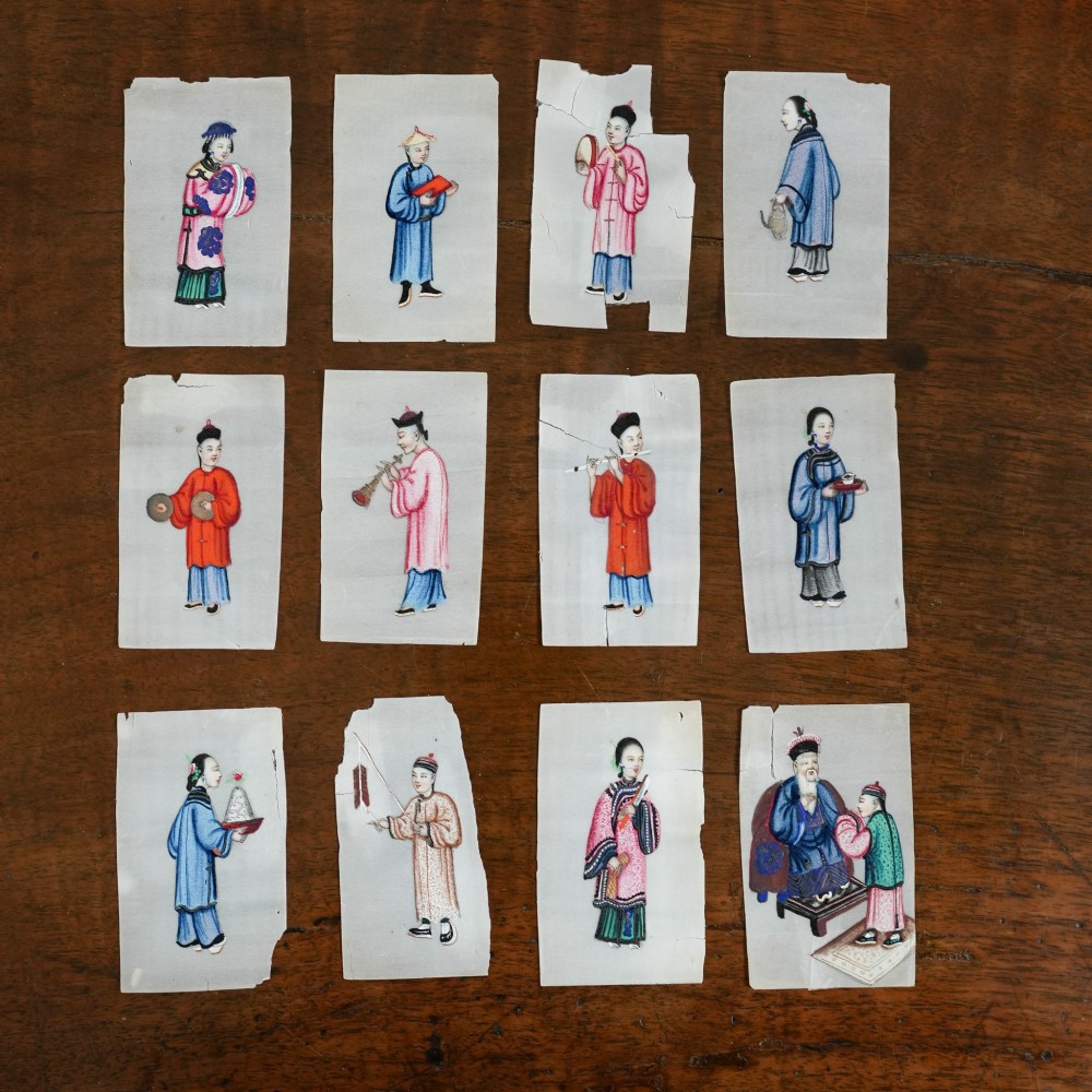 A set of twelve 19th-century Chinese pith paper paintings depicting various figures in traditional Qing dynasty attire playing musical instruments and holding cultural objects.