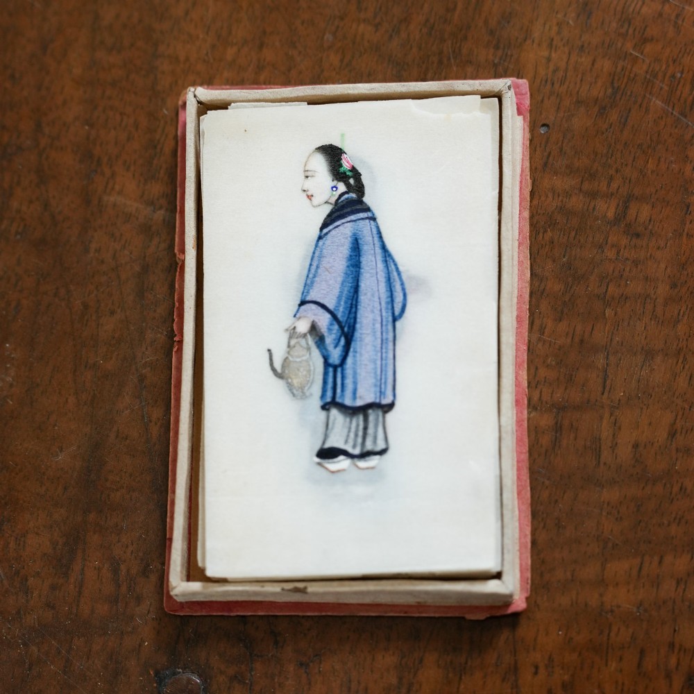 A set of twelve 19th-century Chinese pith paper paintings depicting various figures in traditional Qing dynasty attire playing musical instruments and holding cultural objects. View II