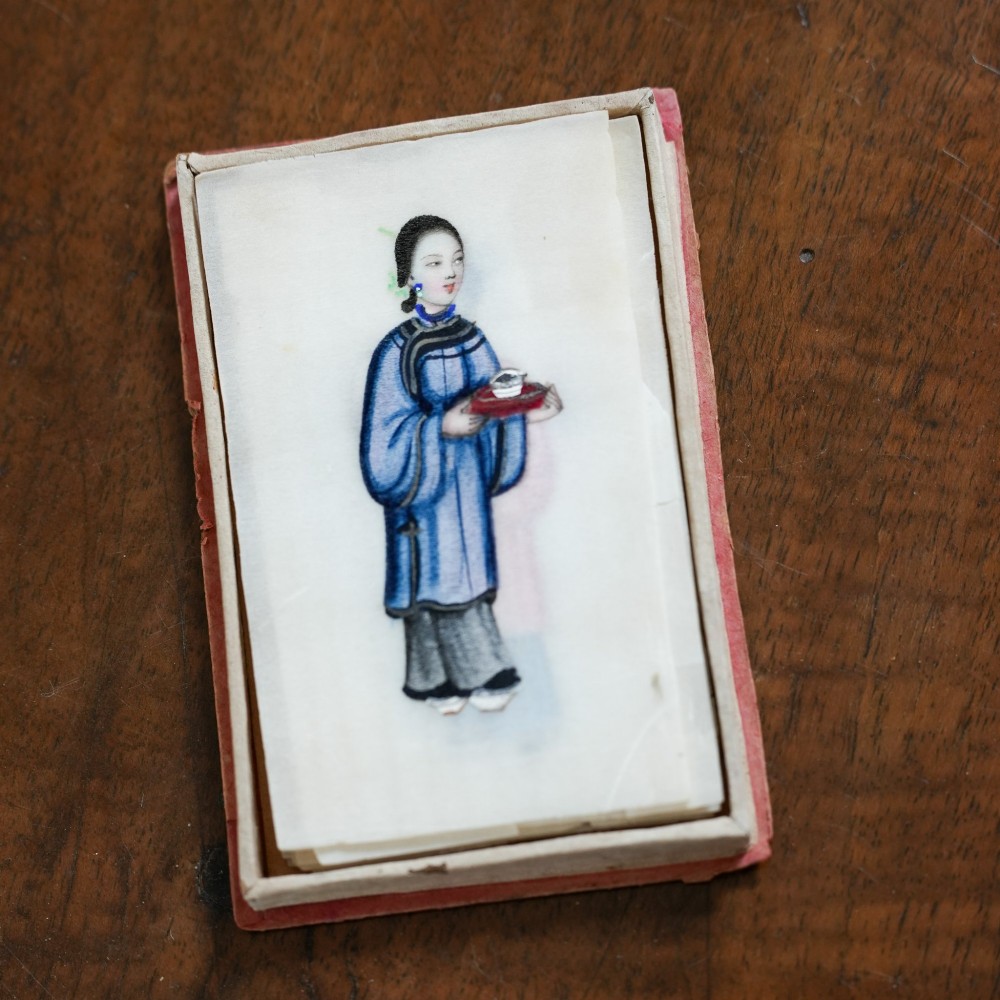 A set of twelve 19th-century Chinese pith paper paintings depicting various figures in traditional Qing dynasty attire playing musical instruments and holding cultural objects. View III