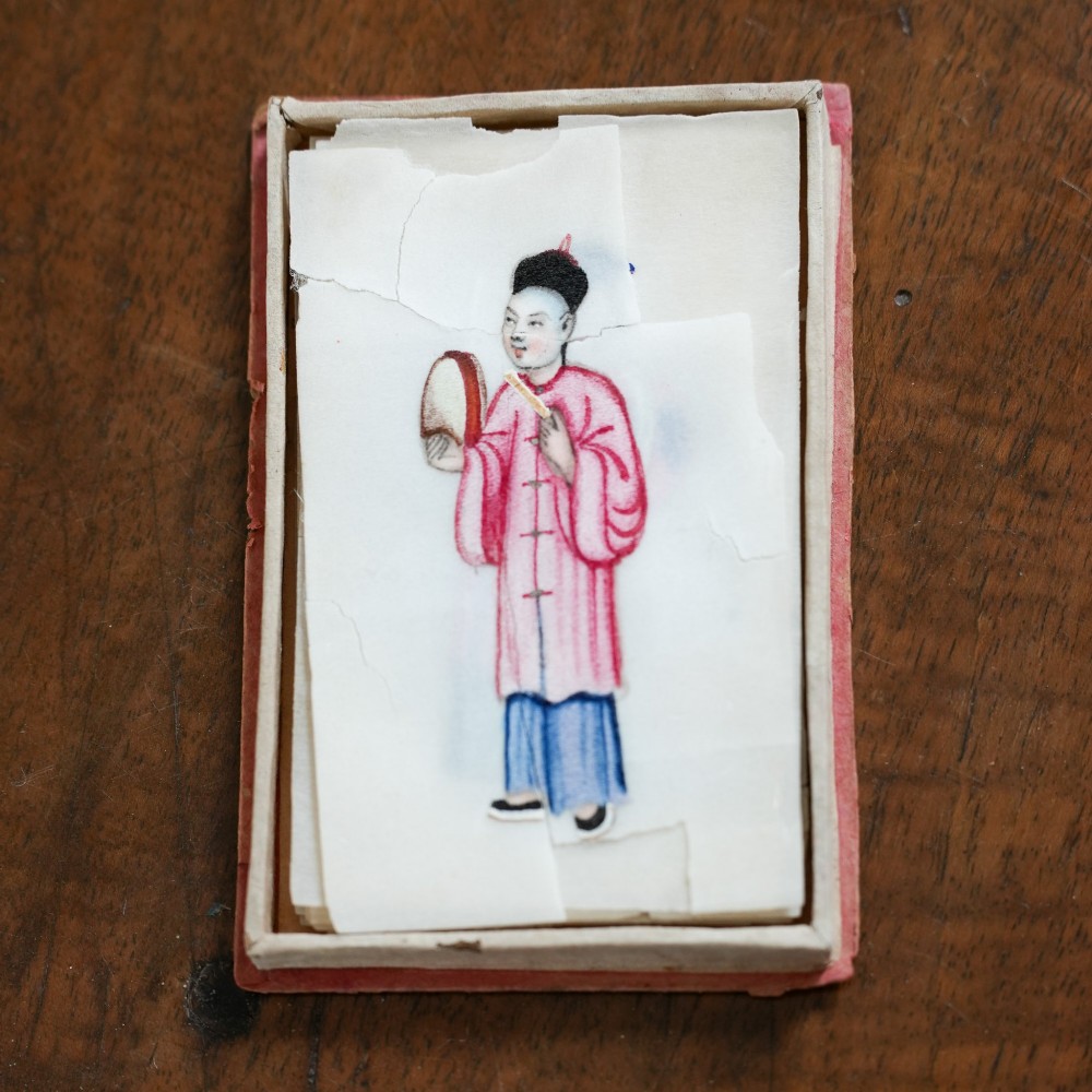 A set of twelve 19th-century Chinese pith paper paintings depicting various figures in traditional Qing dynasty attire playing musical instruments and holding cultural objects. View IV
