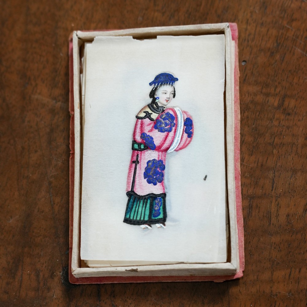 A set of twelve 19th-century Chinese pith paper paintings depicting various figures in traditional Qing dynasty attire playing musical instruments and holding cultural objects. View V