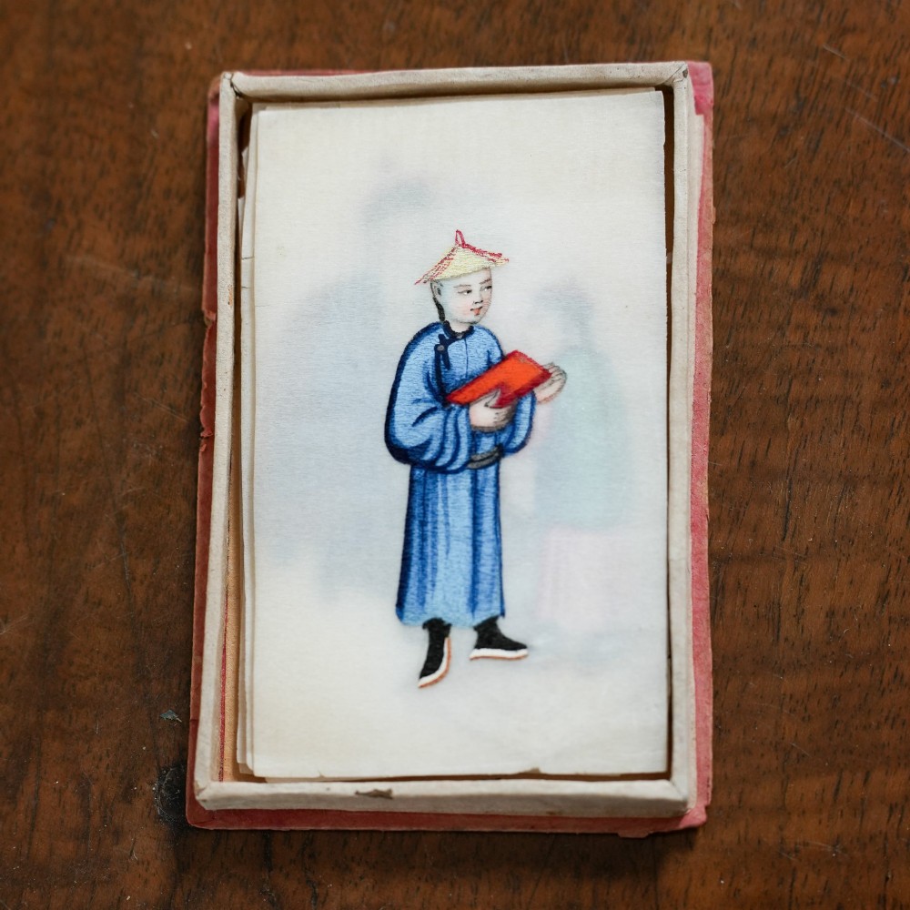 A set of twelve 19th-century Chinese pith paper paintings depicting various figures in traditional Qing dynasty attire playing musical instruments and holding cultural objects. View VI