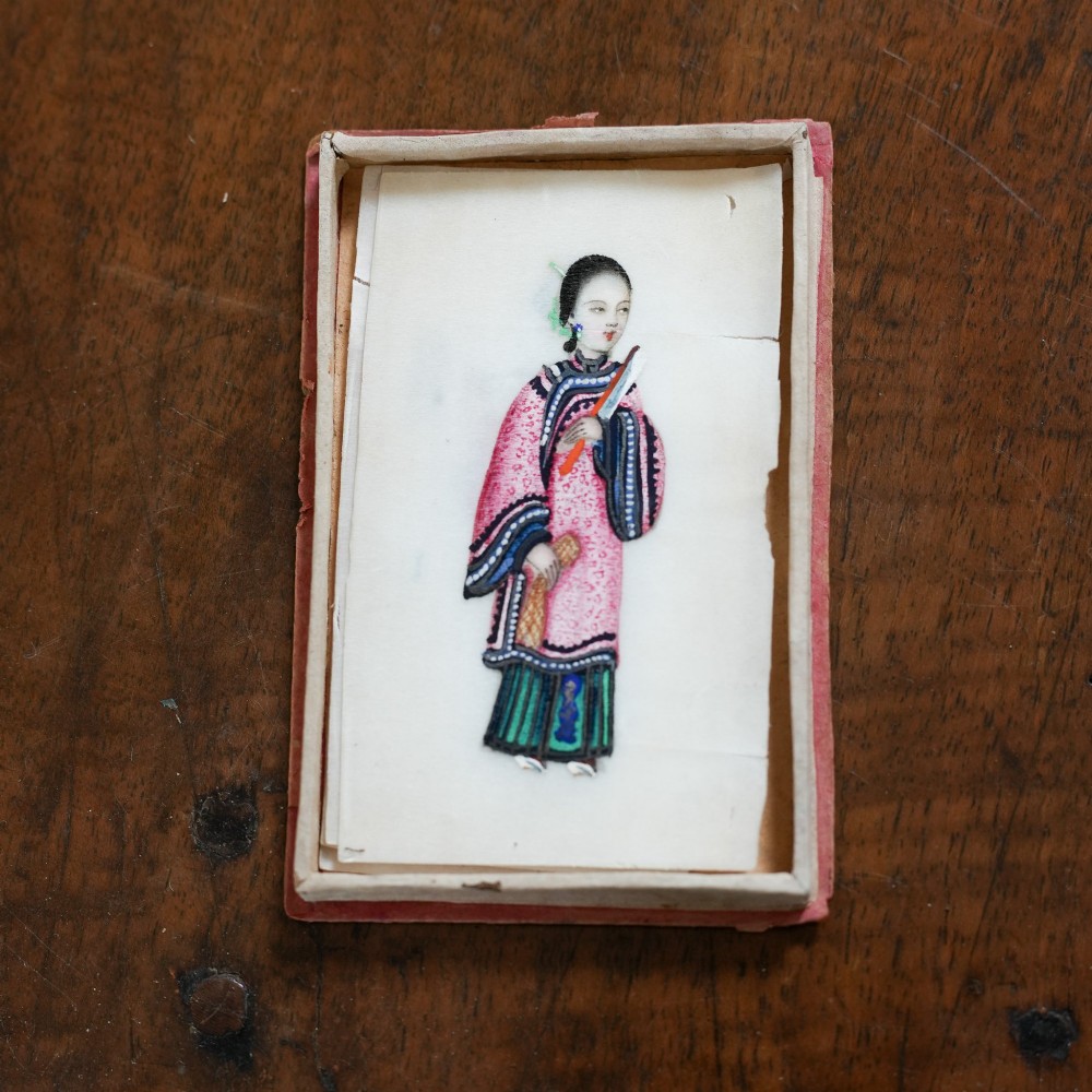 A set of twelve 19th-century Chinese pith paper paintings depicting various figures in traditional Qing dynasty attire playing musical instruments and holding cultural objects. View X