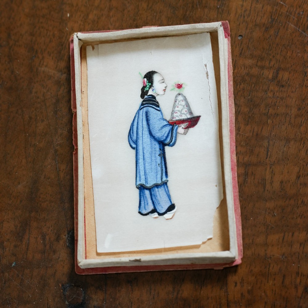 A set of twelve 19th-century Chinese pith paper paintings depicting various figures in traditional Qing dynasty attire playing musical instruments and holding cultural objects. View XIII