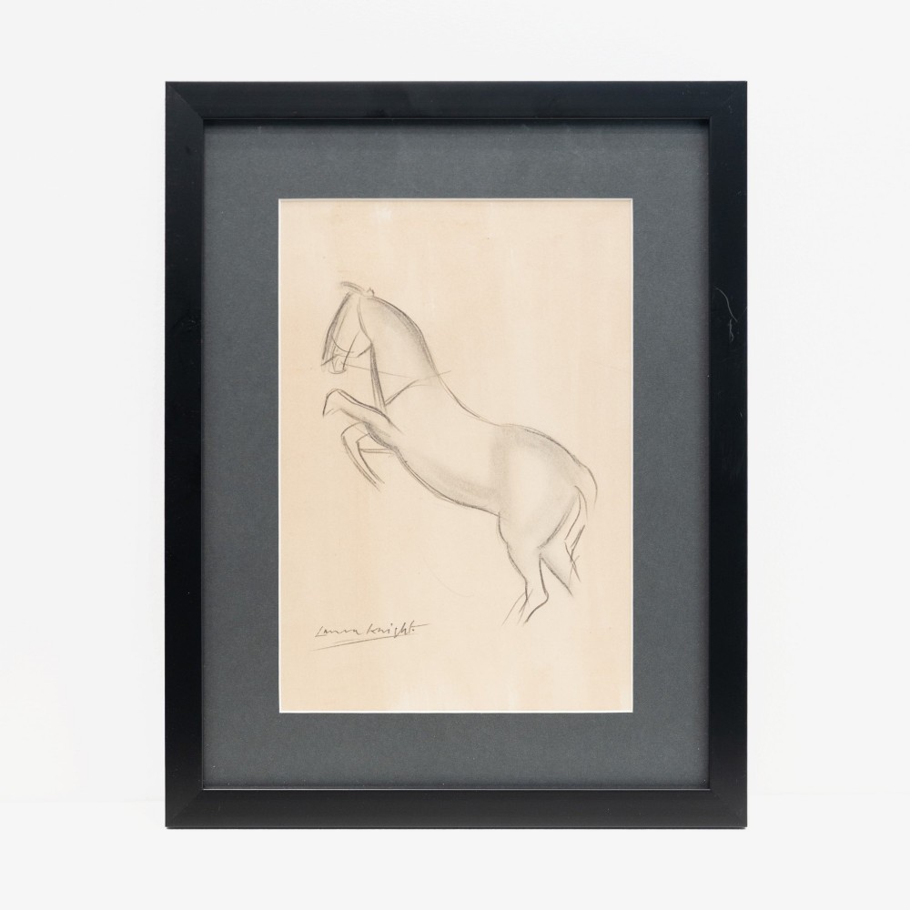 A framed pencil sketch on cream paper depicting a rearing horse, signed by Laura Knight at the bottom left, mounted in a dark grey mat and black frame.