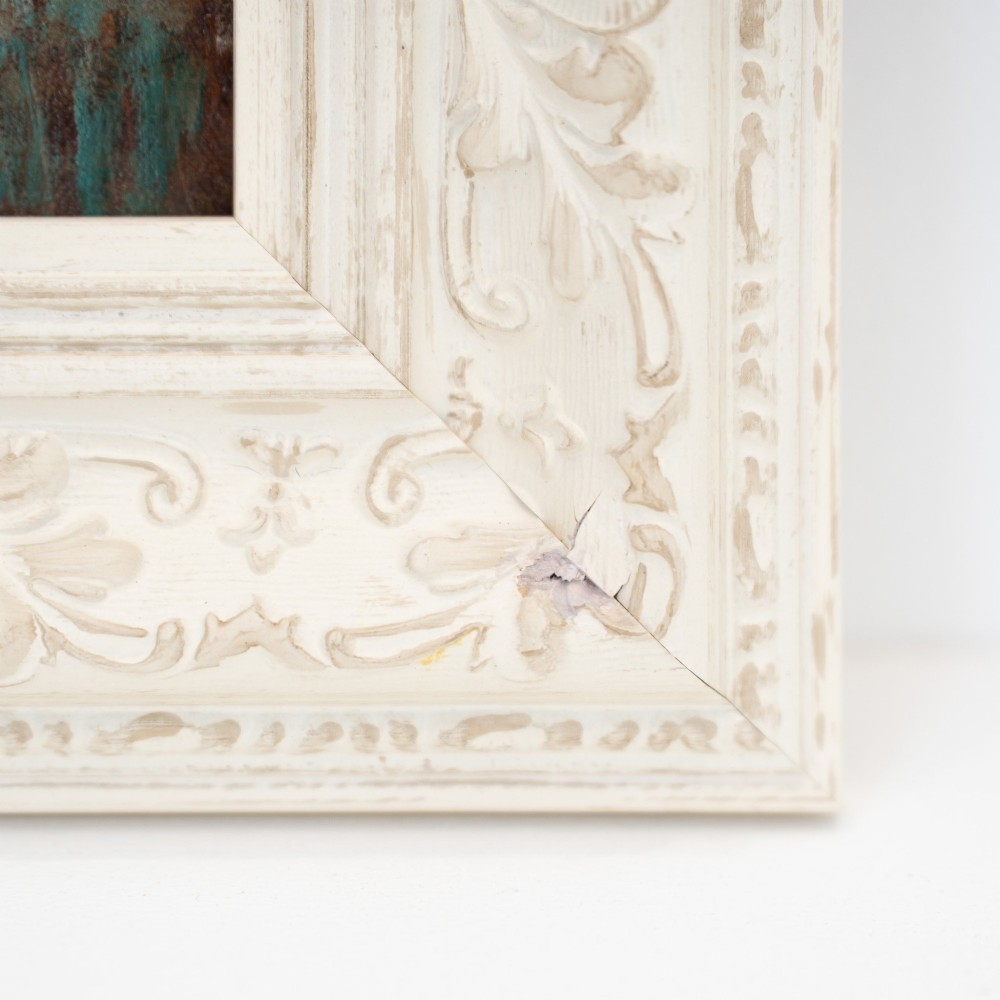 An oil painting on wooden panel depicting a European townscape with a central church spire, set within an off-white carved decorative frame. View VIII