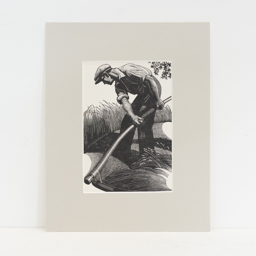 A black and white wood engraving of a male figure using a scythe in a field, presented within a neutral window mount.