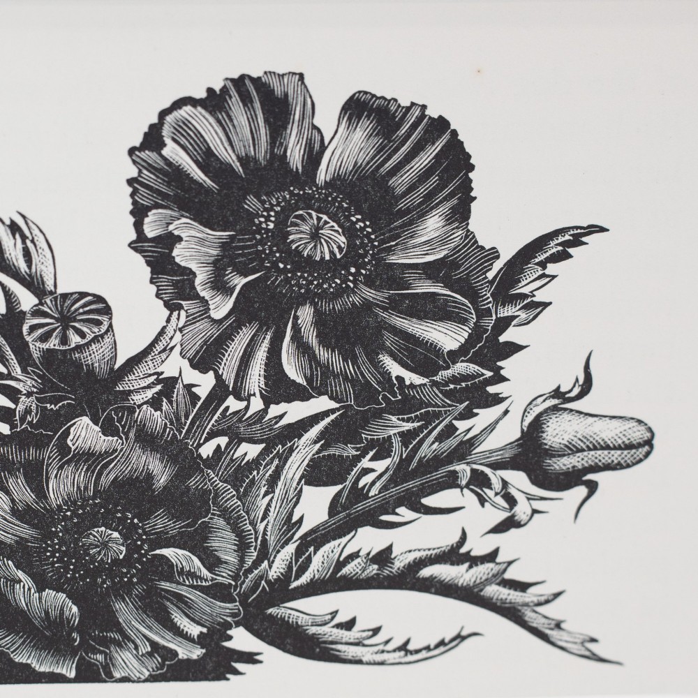 A black and white wood engraving depicting detailed poppy flowers and seed pods, presented within a grey card mount. View III