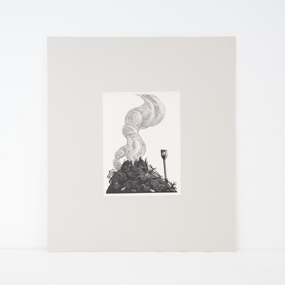 A monochrome wood engraving depicting a garden bonfire with a plume of smoke curling upwards beside an upright spade, presented in a light grey mount.