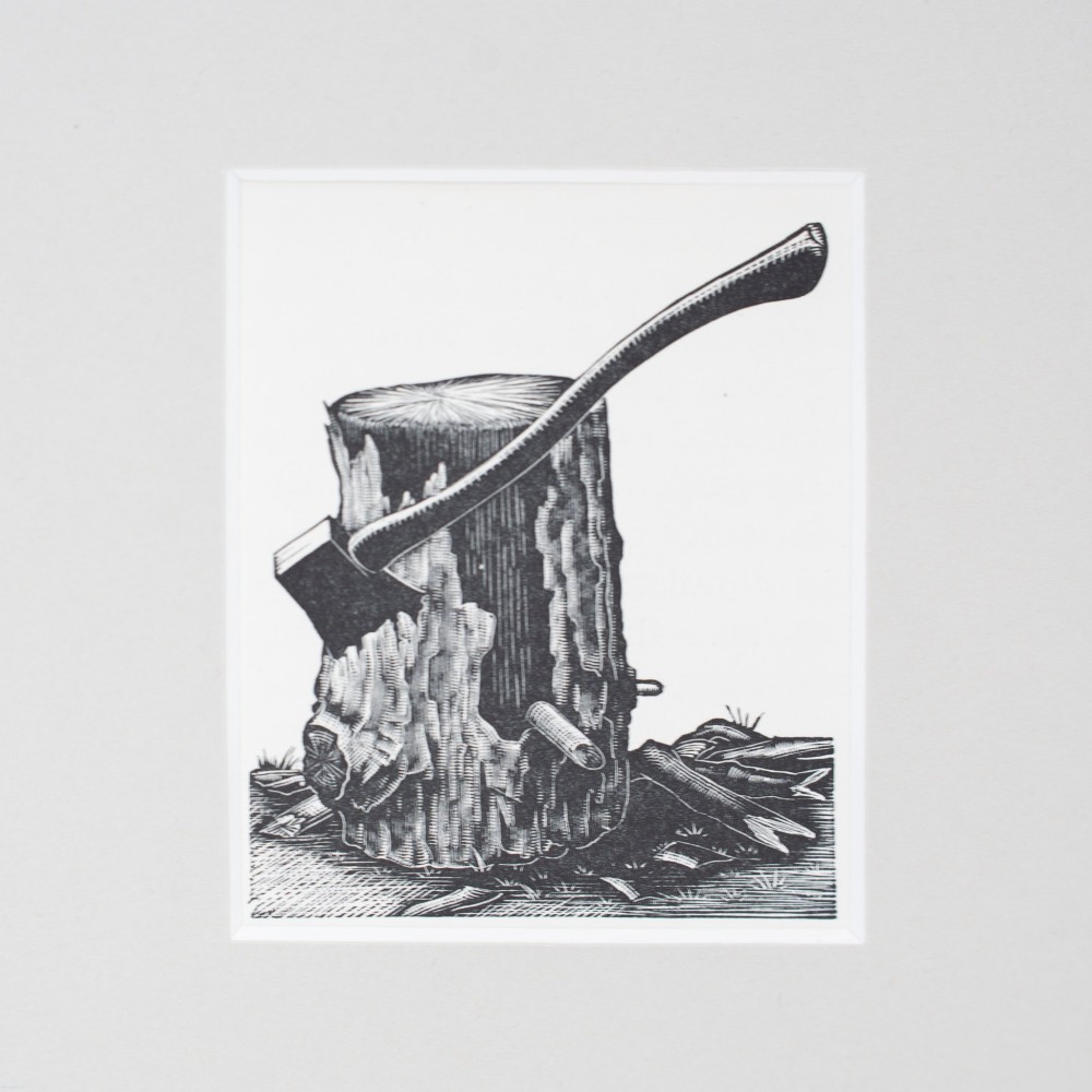 A monochrome wood engraving depicting an axe stuck into a wooden chopping block, presented in a square neutral mount. View II