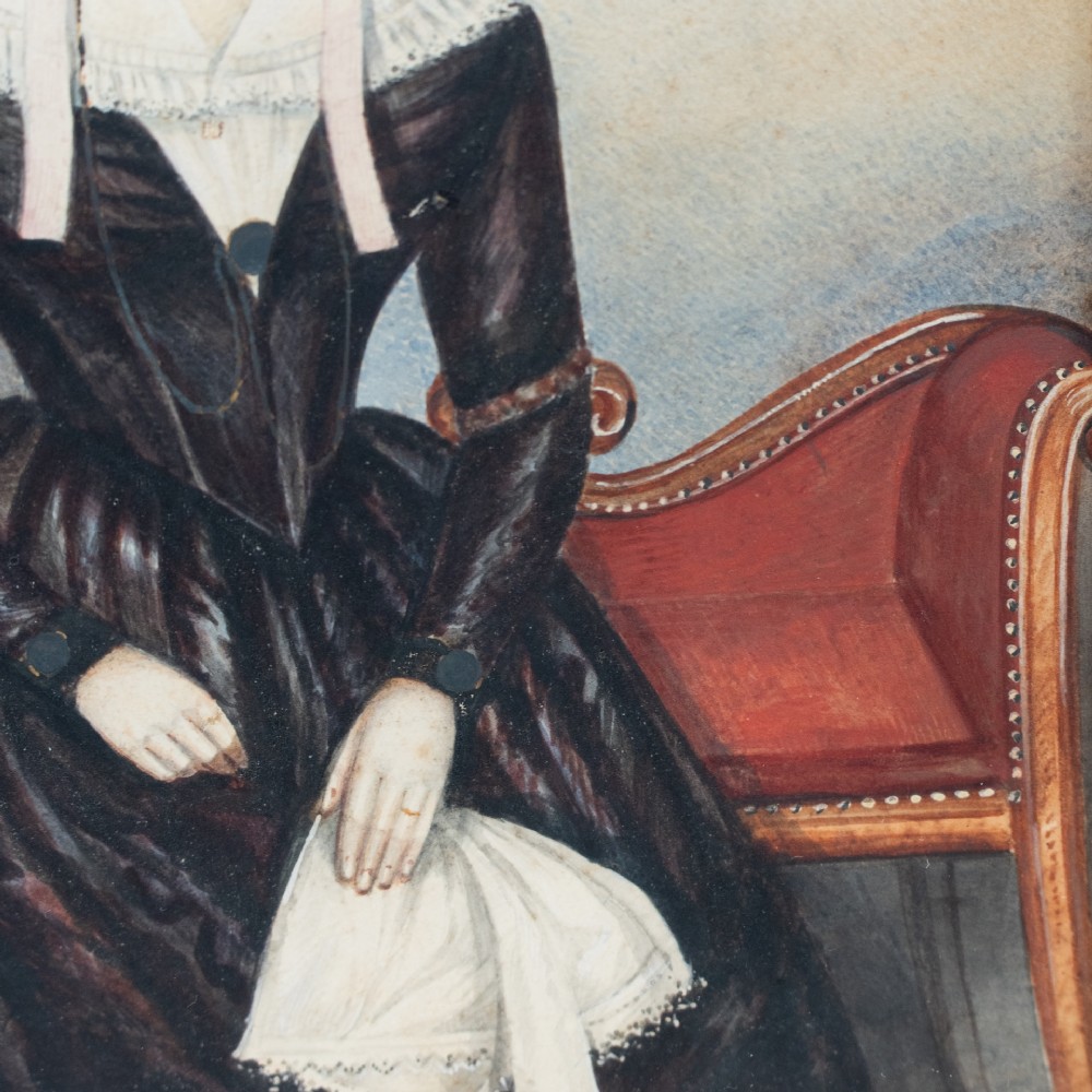 A pair of mid-19th century framed folk art portraits depicting a seated woman and man in period clothing. View VII