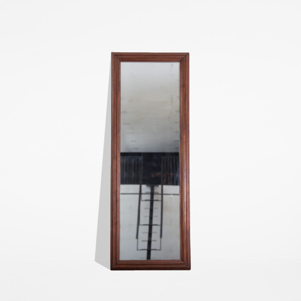 A tall rectangular 19th-century mirror featuring a dark brown moulded walnut wood frame.