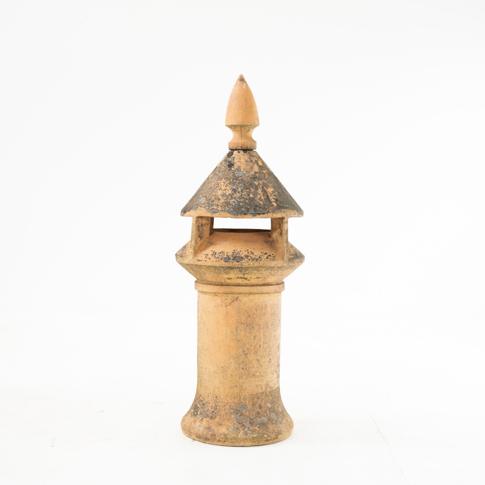 A late Victorian buff terracotta exhaust cowl chimney pot featuring a vented cap and pointed finial top. View IV