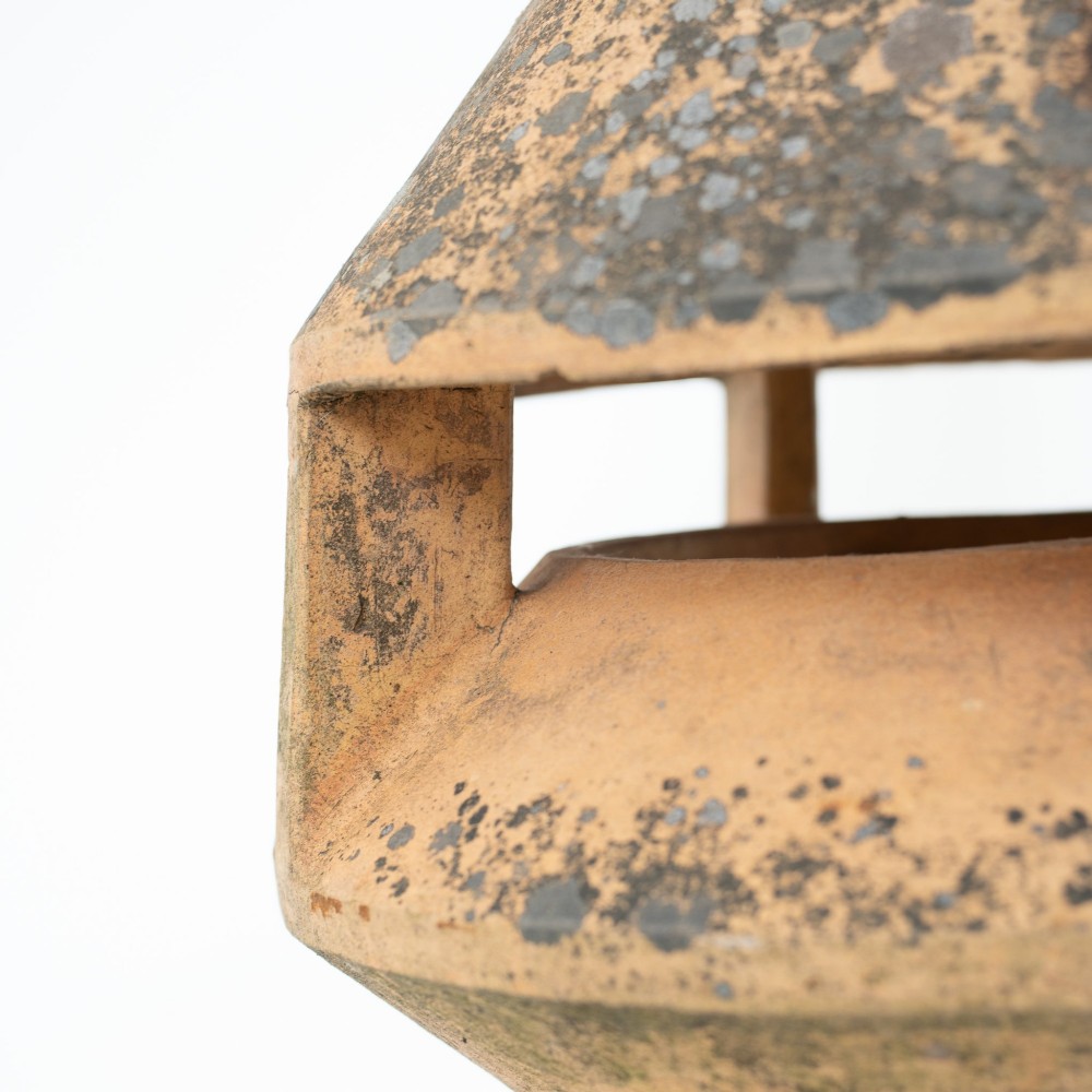 A late Victorian buff terracotta exhaust cowl chimney pot featuring a vented cap and pointed finial top. View VI