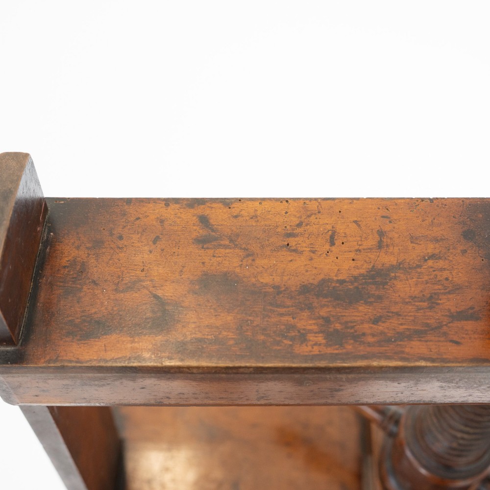 A Victorian mahogany and pine linen press featuring a central wooden screw mechanism over two small drawers with turned black knobs and four square legs. View XII