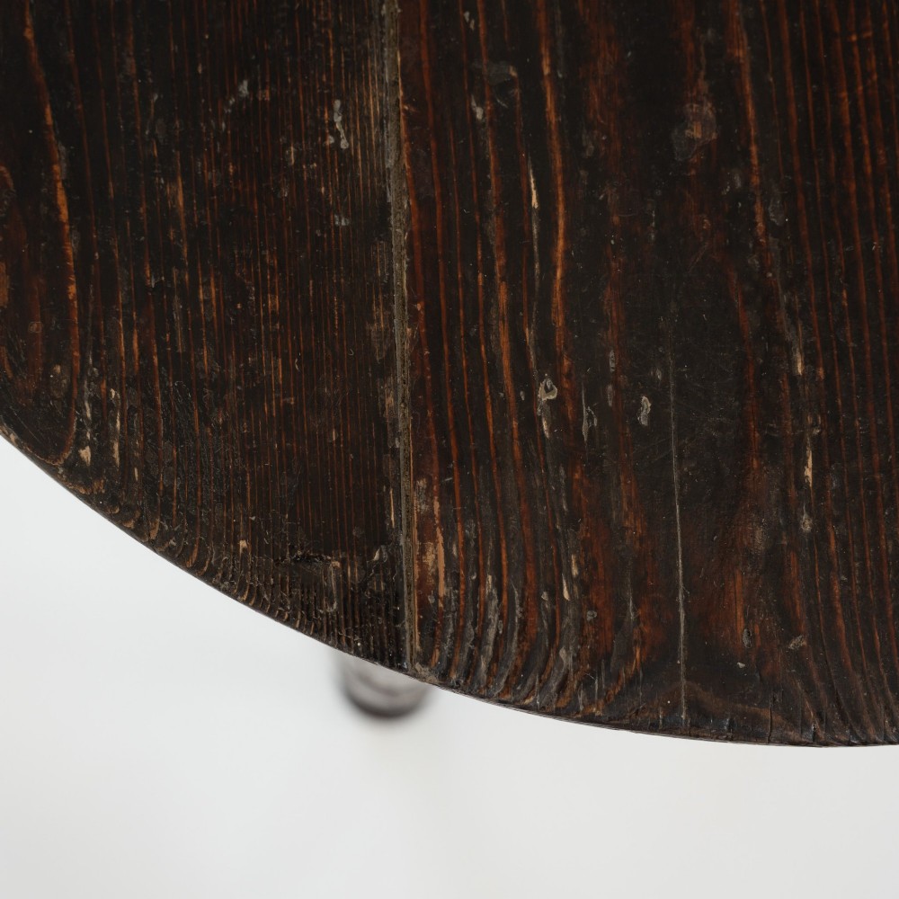 A 19th-century circular pine cricket table featuring a dark painted finish and three turned legs. View VIII