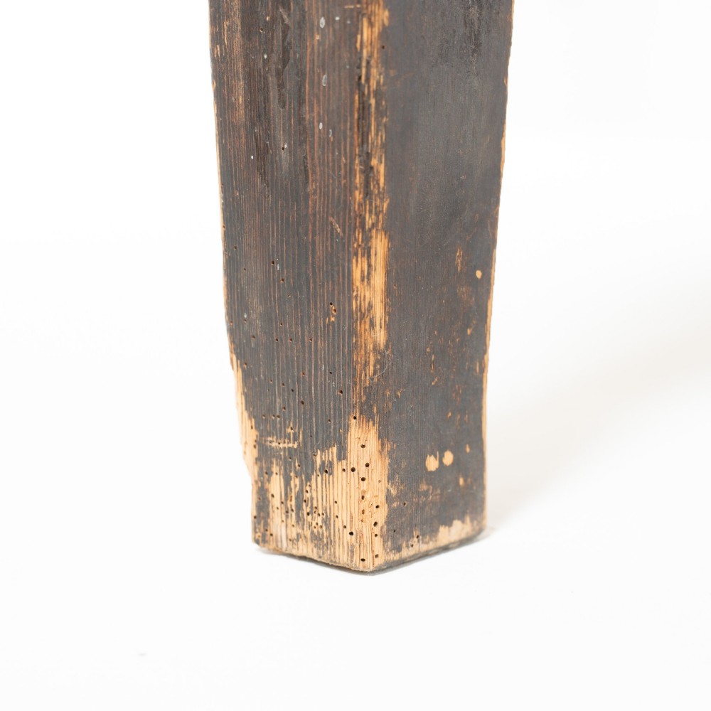 An eight-foot long Victorian pine harvest table featuring a natural timber top surface, a distressed black painted apron, and tapered square legs. View IX