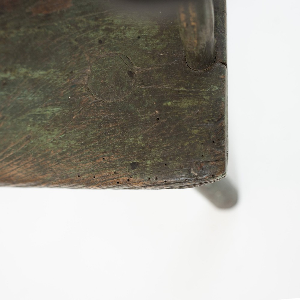 A 19th-century primitive childs stick-back armchair crafted from dark patinated timber with splayed legs and a crest rail. View IX