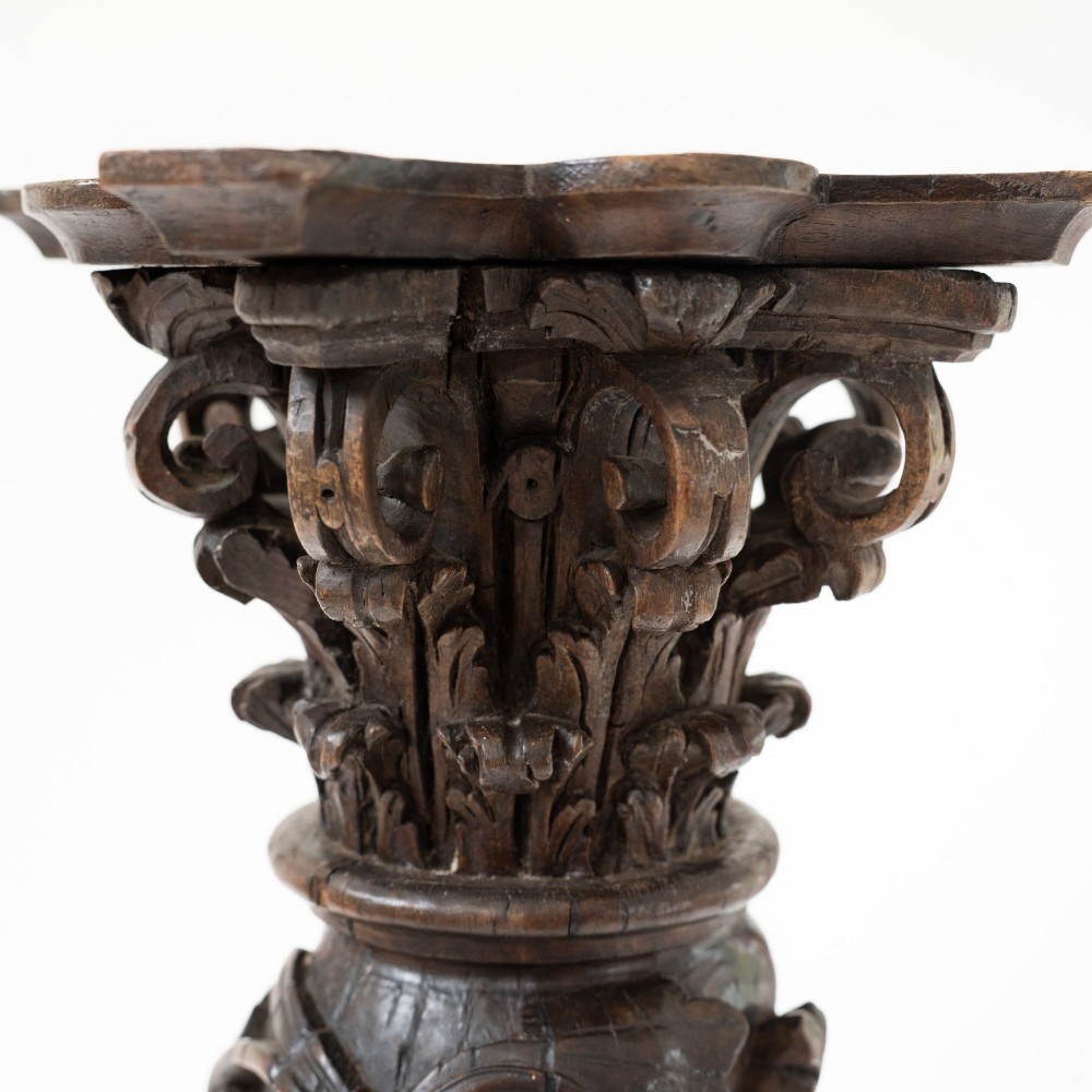 A dark carved oak Solomonic pedestal column with a spiralled grapevine shaft, Corinthian capital, and stepped square base. View IX