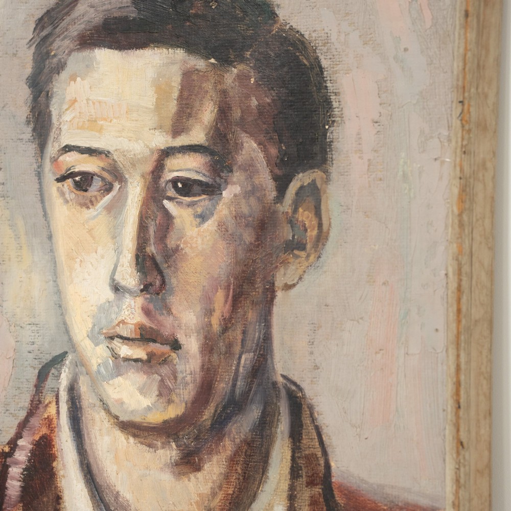 A mid-century oil painting depicting a young man in a collar shirt and jacket, set within a simple wooden frame. View II
