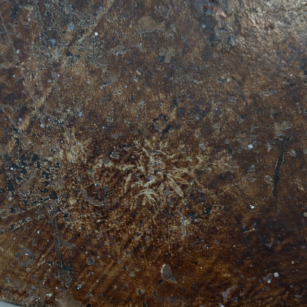 An English nineteenth-century dark brown wooden cricket table featuring a circular top and three turned legs. View VI