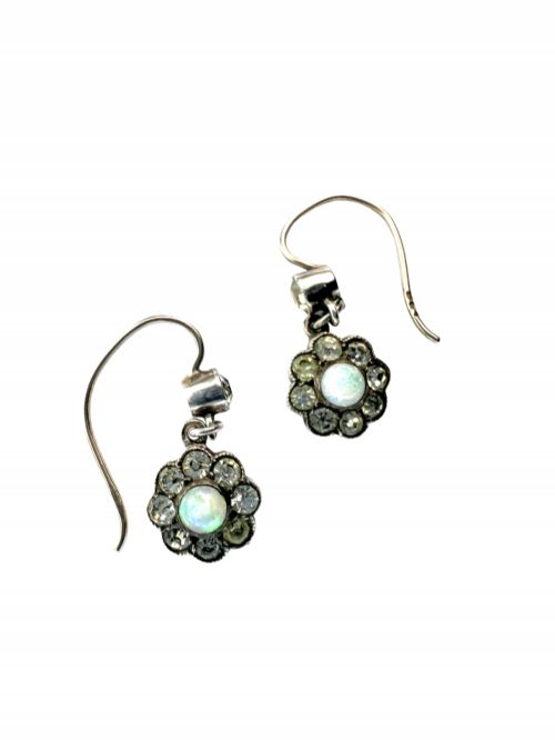 fig 1. A pair of antique silver drop earrings featuring central opals surrounded by sparkling paste stones in floral cluster settings.