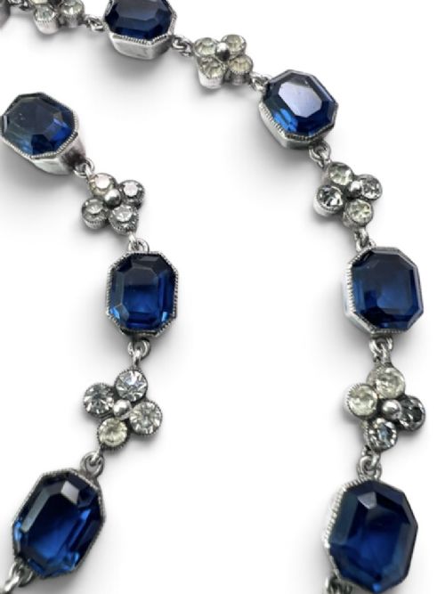 An Art Deco silver jewellery set comprising a link necklace and drop earrings with octagonal blue paste stones and clear cluster links. View III